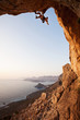 Rock climber at sunset, Kalymnos Island, Greece
