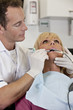 A female patient having an x-ray at the dentists