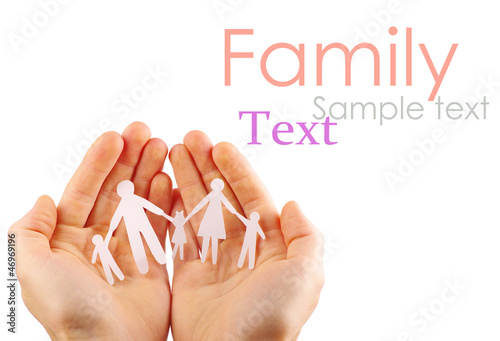 Photo: Paper family in hands isolated on white background Paper family in hands isolated on white background