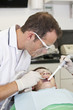 A young boy patient having dental treatment, close up