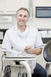 A male dentist in a dental surgery