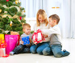 Happy Children with Christmas gifts
