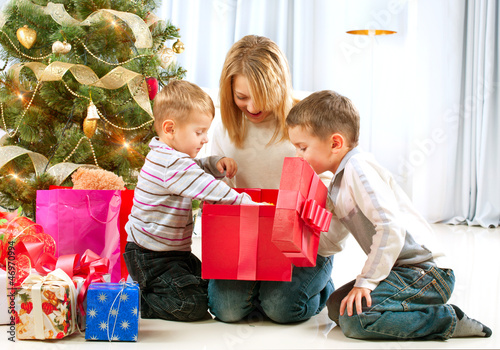 Photo: Happy Children with Christmas gifts Happy Children with Christmas gifts