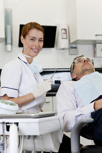 Photo: A female dentist with a male patient A female dentist with a male patient