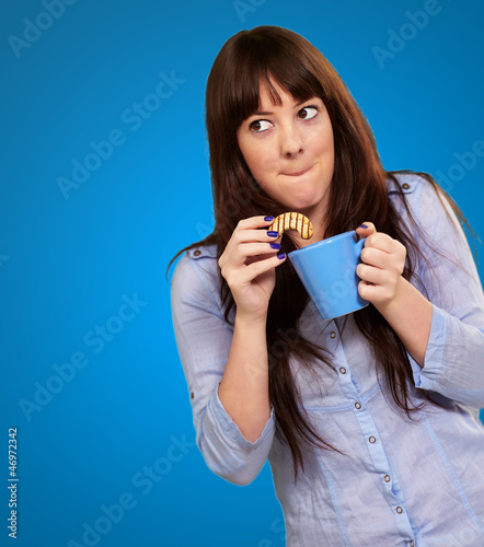 Photo: Beautiful Woman With Coffee And Cookies Beautiful Woman With Coffee And Cookies