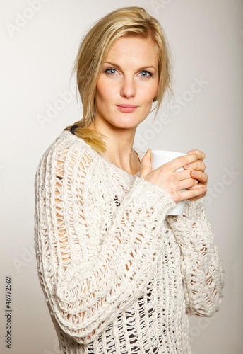 Photo: Attractive Woman with a Cup of Coffee Attractive Woman with a Cup of Coffee