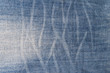 Textura de la tela vaquera lavada a la piedra con dibujos
