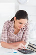 Woman using a calculator