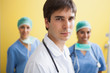 Doctor with two smiling nurses