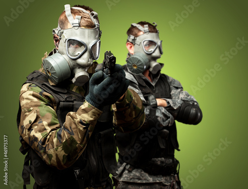 Photo: Portrait Of Soldiers With Gun And Gas Mask Portrait Of Soldiers With Gun And Gas Mask