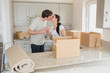 Photo: Happy couple kissing in the kitchen Happy couple kissing in the kitchen