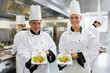 Two Chef's showing salmon dishes