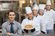 Photo: Waiter standing in front of Chef's Waiter standing in front of Chef's