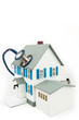 Blue stethoscope taking care of the house