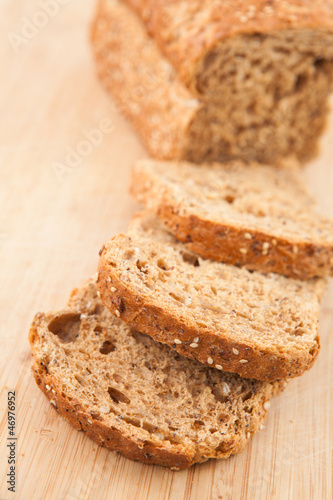Photo: Partially sliced brown bread Partially sliced brown bread