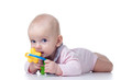 teething baby with toy