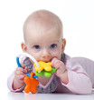 teething baby with toy
