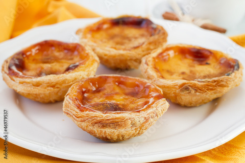 Photo: Pasteis de nata on the white plate Pasteis de nata on the white plate