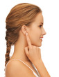 woman pointing to ear