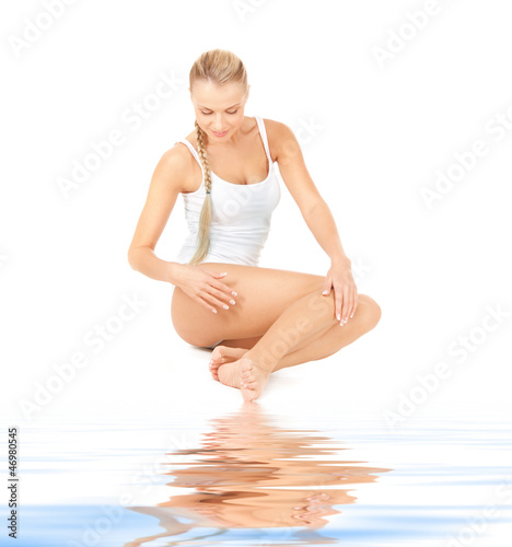 Photo: beautiful woman in cotton undrewear on white sand beautiful woman in cotton undrewear on white sand
