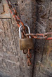 Foto: Old door with padlock Old door with padlock