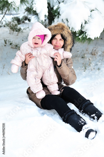 Photo: mother with her baby in snow mother with her baby in snow