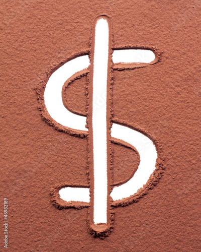 Photo: Dollar drawn on cocoa powder Dollar drawn on cocoa powder