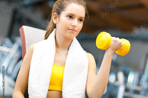 Photo: Woman lifting dumbbells Woman lifting dumbbells