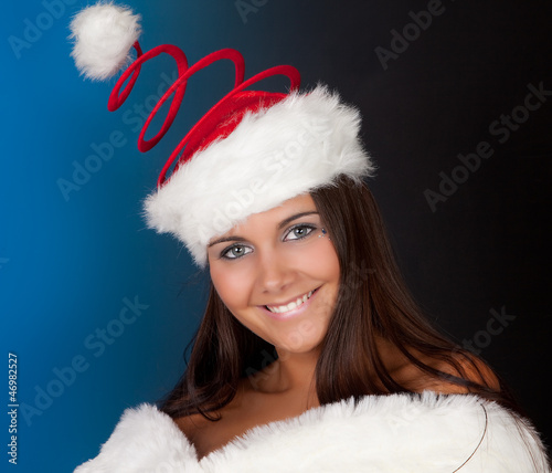 Photo: Christmas hat on winter girl Christmas hat on winter girl
