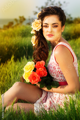 Photo: Beautiful woman with flowers in her hair Beautiful woman with flowers in her hair