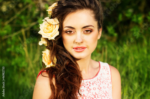 Photo: Beautiful woman with flowers in her hair Beautiful woman with flowers in her hair