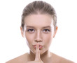 Young beautiful blonde requesting silence