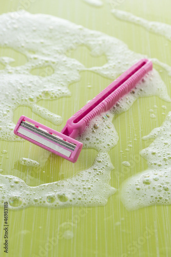 Photo: Pink disposable razor with foam Pink disposable razor with foam