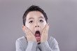 Boy acts surprised.
