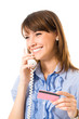 Young businesswoman with plastic card, on phone