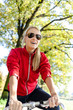 Happy woman cycling on bicycle