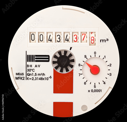 Photo: Water meter. It is isolated on a black background. Water meter. It is isolated on a black background.