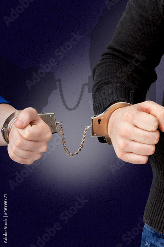 Photo: Men and women connected with handcuffs Men and women connected with handcuffs