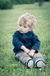 One year boy playing in the park portrait.