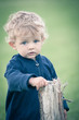 One year boy playing in the park portrait.