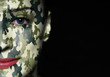 Camouflage painted on woman a face