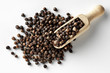 black peppercorns with wooden spoon