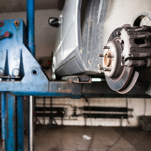 Photo: inside a garage - changing wheels/tires inside a garage - changing wheels/tires