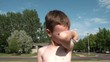 Boy Kissing Muscles, Smiling, Gives Thumbs Up