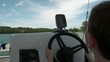 Boy Driving Boat on Lake Supervised