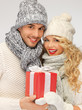 romantic couple in a sweaters with gift box