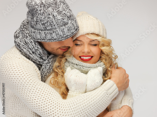 Photo: family couple in a winter clothes family couple in a winter clothes