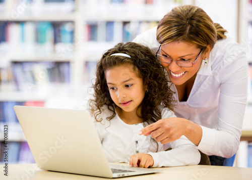Photo: Schoolgirl researching online Schoolgirl researching online