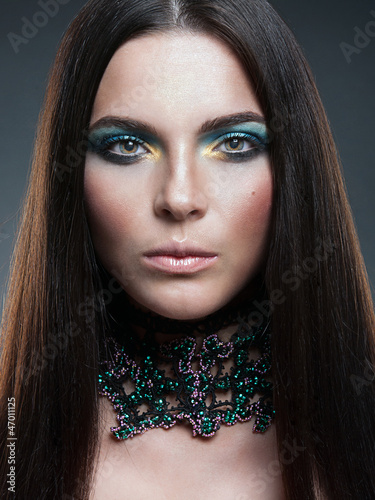 Photo: Portrait of beautiful woman model with professional makeup Portrait of beautiful woman model with professional makeup