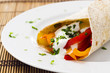 Vegetarian wrap filled with sour cream and grilled peppers